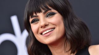 Mila Kunis wearing eyeshadow looks brown eyes