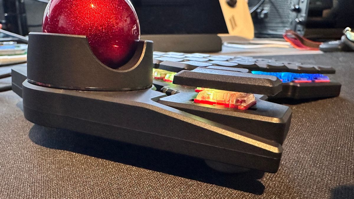 A close-up photo of the ZSA Navigator module attached to the ZSA Voyager ergonomic keyboard