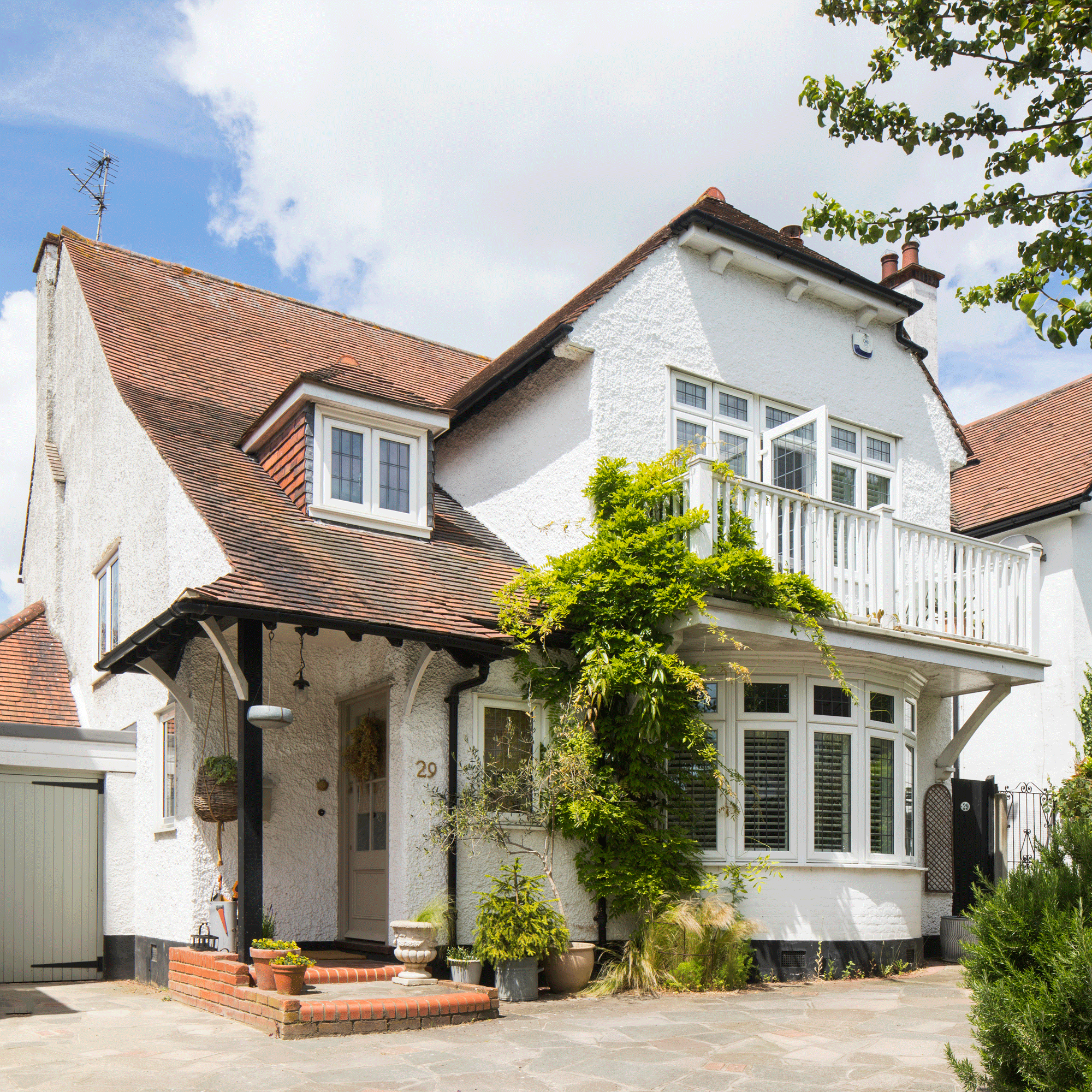 the exterior of an Edwardian house with a first floor balcony