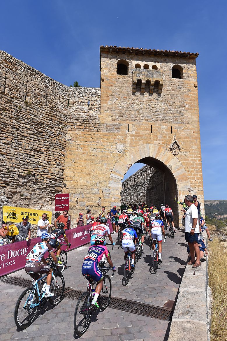 Fans cheer the riders on a short ascent