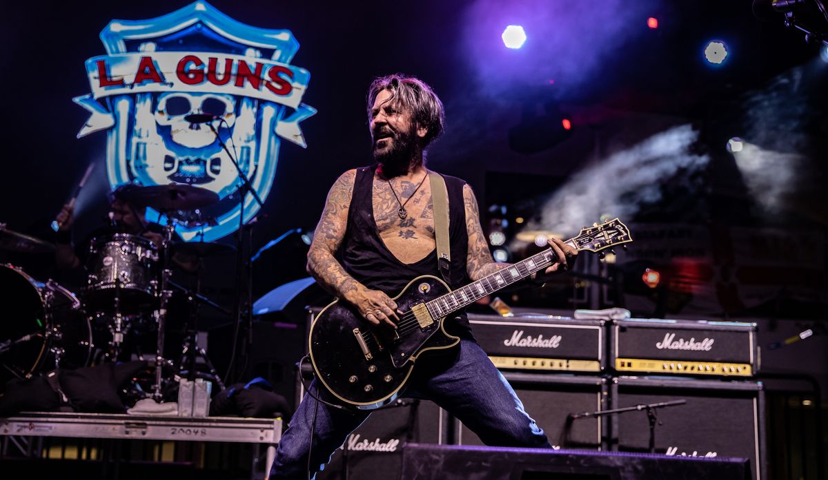 Tracii Guns performs onstage with L.A. Guns