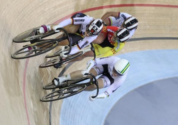Anna Meares hits the front in the keirin heats with Germany's Kristina Vogel