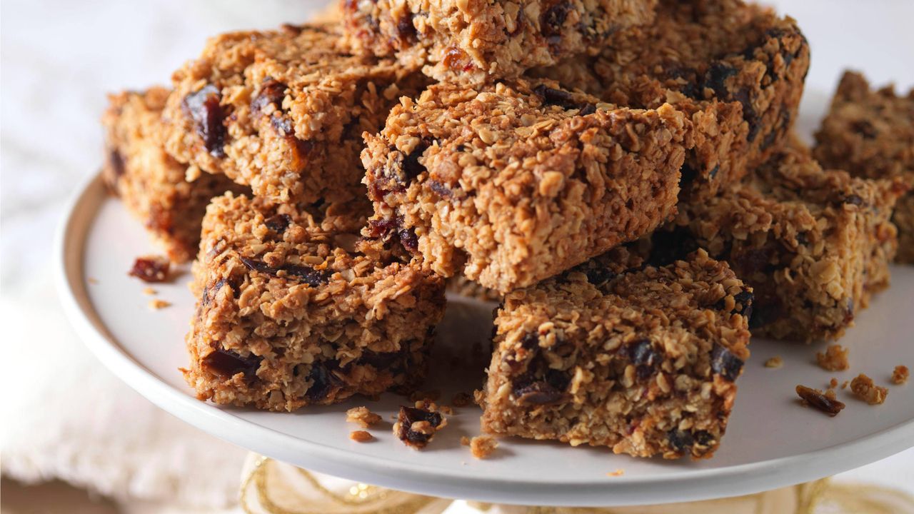 gluten-free flapjacks with orange and dates on a cake stand