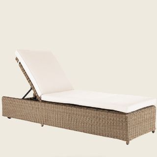 A day bed with rattan style seating
