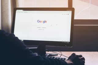 Man on a computer Browsing Google