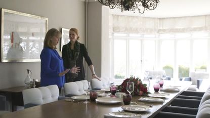 conversation with two ladies and dishes and glasses on dining table 