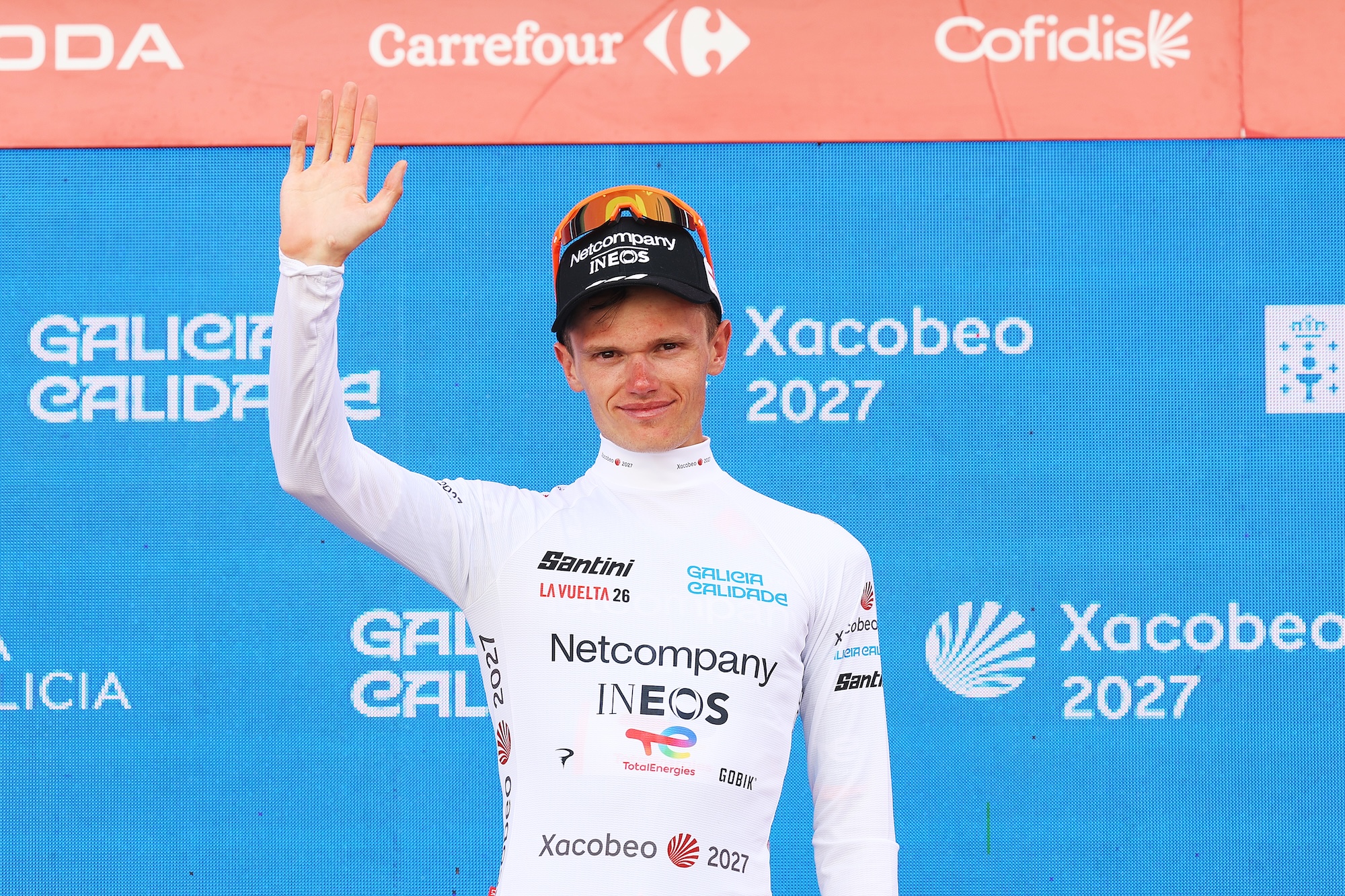 Oscar Onley celebrates at podium as White Best Young Rider Jersey during the La Vuelta