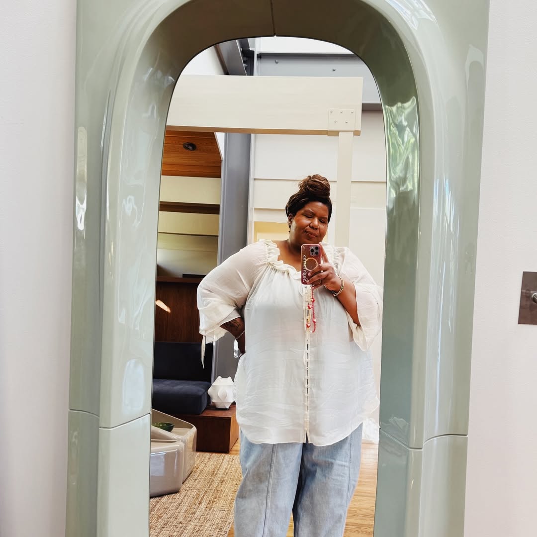 Kellie Brown in a boho-chic blouse and jeans