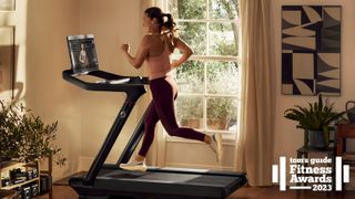 a photo of a woman running on a Peloton Tread