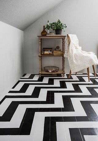 Graphic chevron painted floor design in black and white