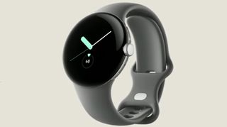 A Google Pixel Watch with a grey strap