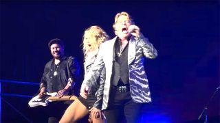 Axl Rose and Carrie Underwood onstage in Los Angeles