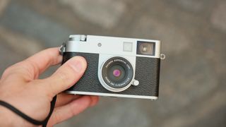 Fujifilm X Half camera held in a hand