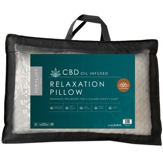 white pillow with cbd oil in black bag