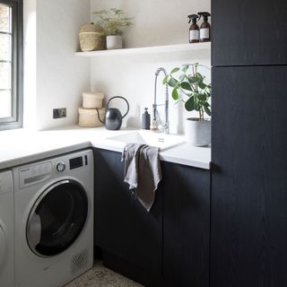 White and grey kitchen with fitted washing machine