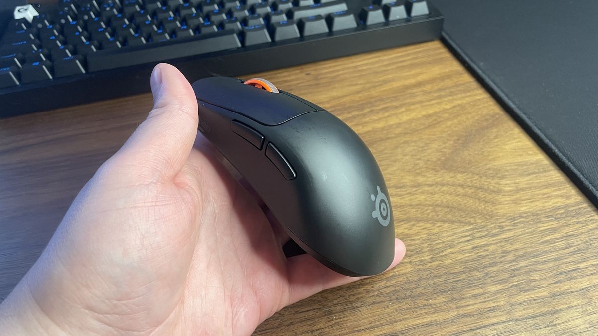 A SteelSeries Sensei Pro gaming mouse.