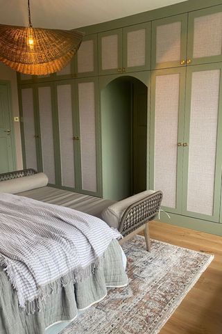 green bedroom with built in storage