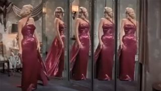 Marilyn Monroe in her pink one shoulder gown in How To Marry A Millionaire