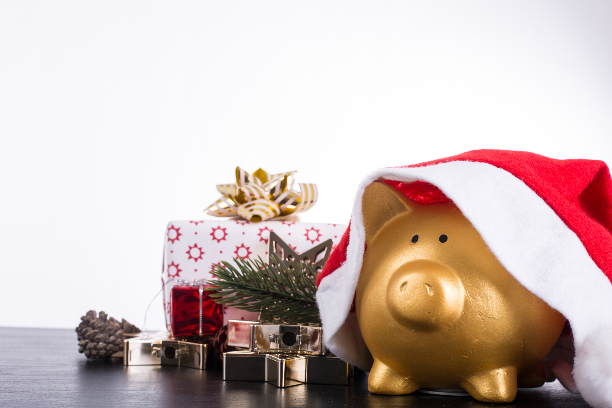 Piggy bank in a santa hat representing the Santa rally