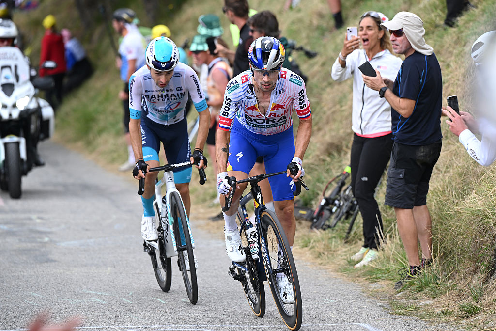 LA PLAGNE, FRANCE - JULY 25: (L-R) Lenny Martinez of France and Team Bahrain - Victorious and Primoz Roglic of Slovenia and Team Red Bull - BORA - hansgrohe compete in the breakaway passing the Cormet de Roselend (1969m) during the 112th Tour de France 2025, Stage 19 a 93.1km stage from Albertville to La Plagne 2062m / #UCIWT / Stage route modified over infected cattle / on July 25, 2025 in La Plagne, France. (Photo by Dario Belingheri/Getty Images)