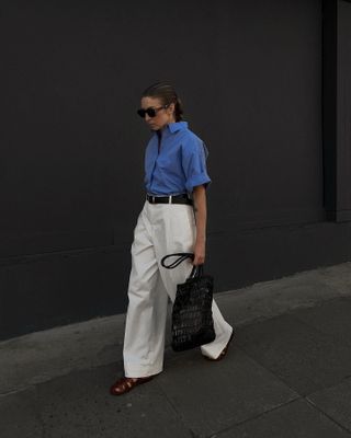 photo of woman wearing fisherman sandals with white jeans and button-down