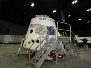 SpaceX displayed their Dragon spacecraft model at the first annual Spacecraft Technology Expo, May 8-10, 2012.