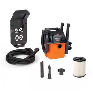 RIDGID 5-gallon Portable Wet/Dry Vacuum with tools and attachments against white background