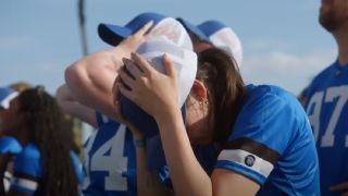 One of the contestants with her head in her hands in Beast Games.