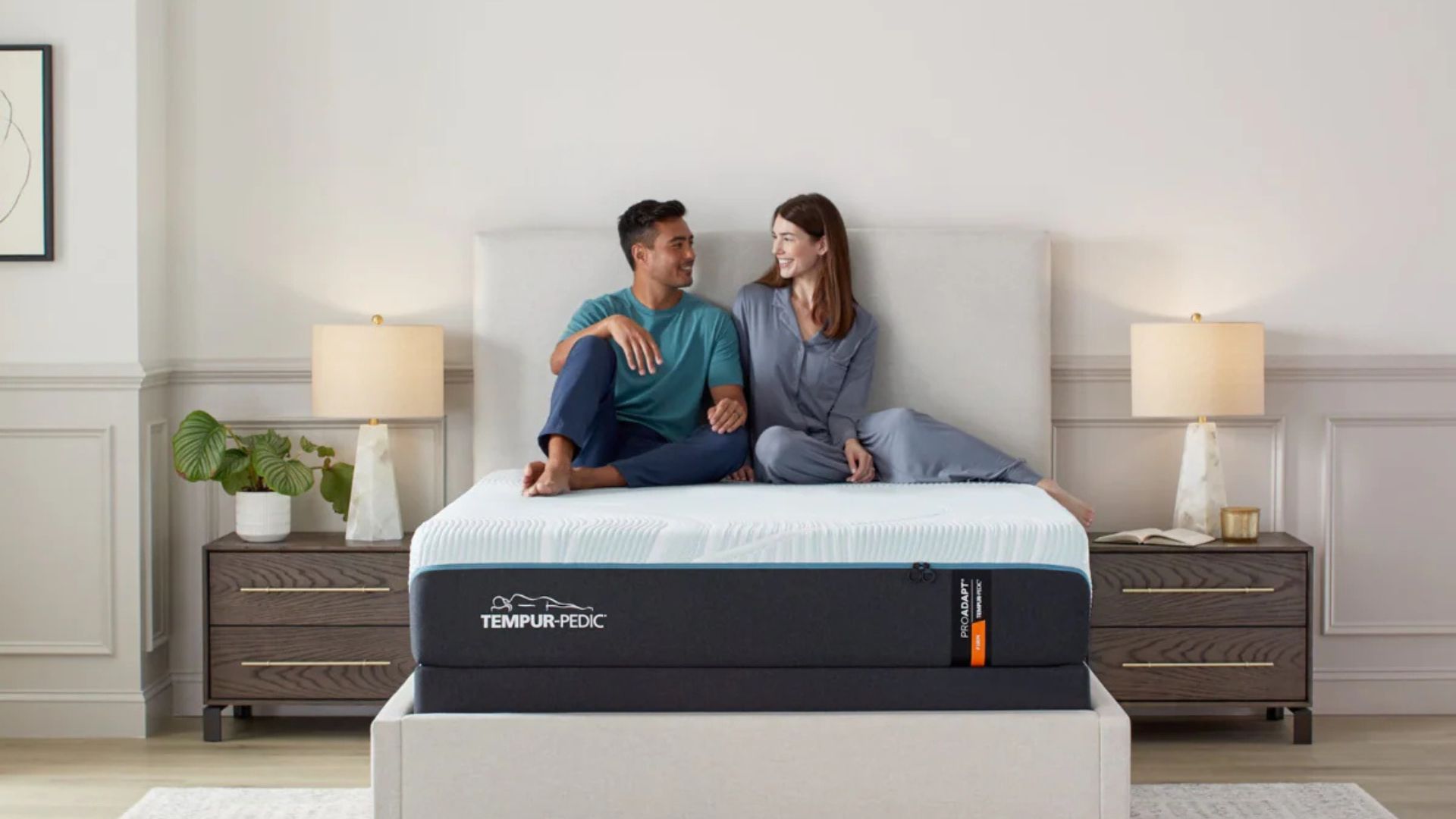 A couple sat on the Tempur-Pedic Tempur-ProAdapt mattress