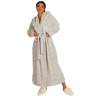 christmas gifts for her woman wearing a long grey dressing gown with a heart print