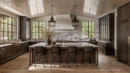 A dark wood kitchens with marble countertops and a curved glossy ceiling
