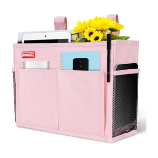 A pink bedside storage organizer