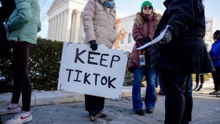 Protestors supporting TikTok outside a Supreme Court hearing