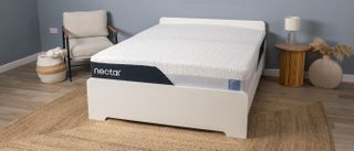 The Nectar Classic Memory Foam Mattress on a bed frame in a bedroom