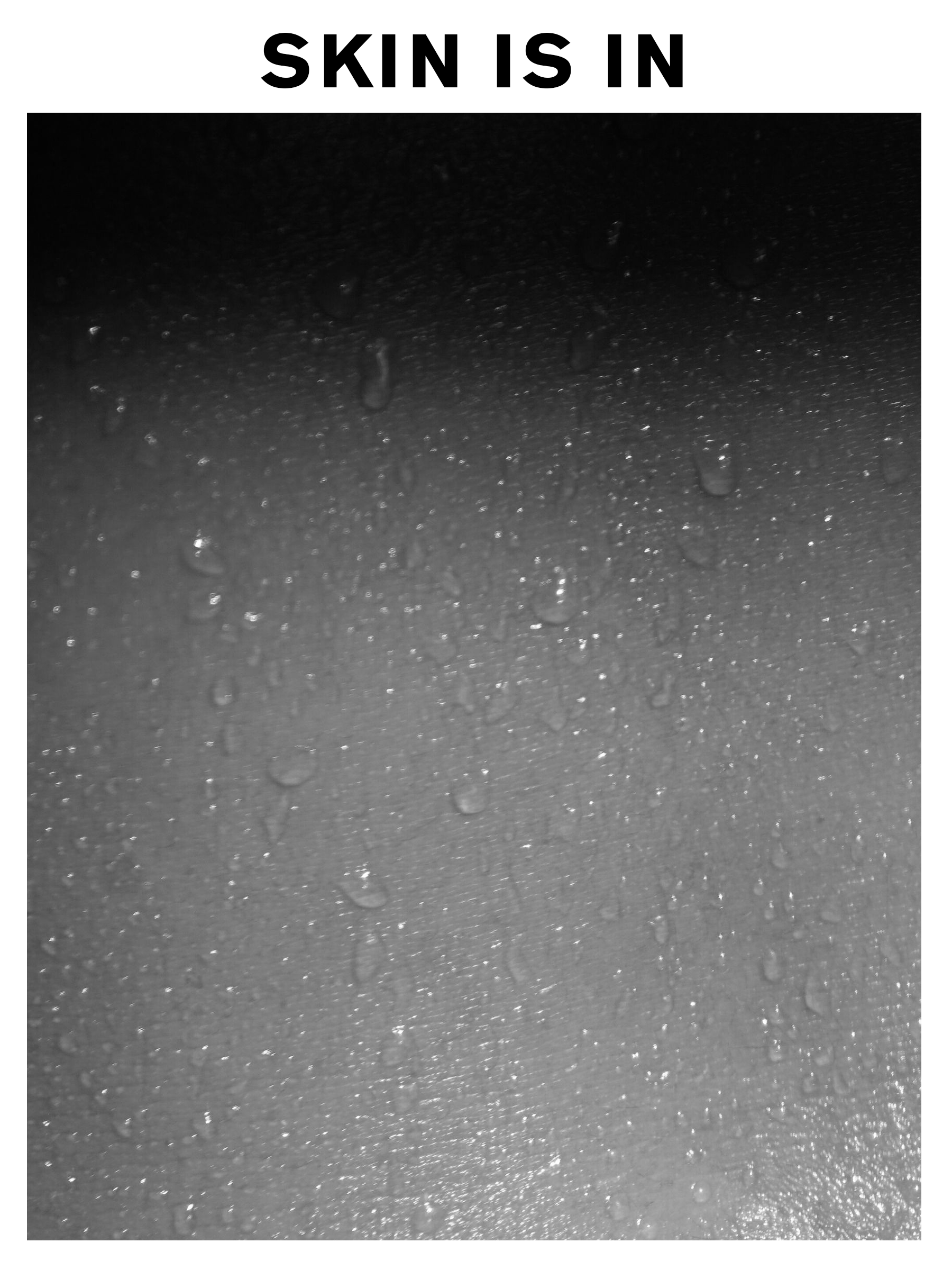 A black and white image of wet skin with the copy 