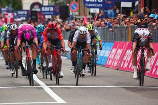 UAE Team Emiratess German rider Pascal Ackermann R crosses the finish line to win ahead of Bahrain Victoriouss Italian rider Jonathan Milan L and Astana Qazaqstan Teams British rider Mark Cavendish C the eleventh stage of the Giro dItalia 2023 cycling race 219 km between Camaiore and Tortona on May 17 2023 Photo by Luca Bettini AFP Photo by LUCA BETTINIAFP via Getty Images