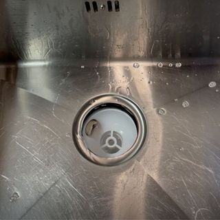 Cleaning hidden part of kitchen sink plughole