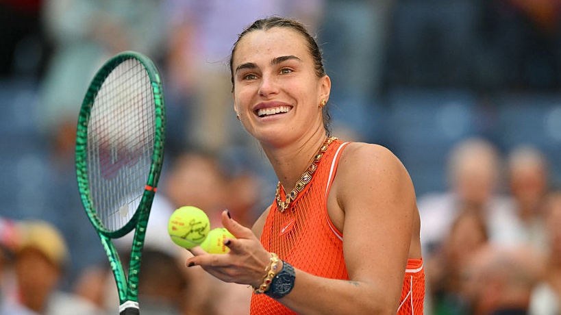 Belarus's Aryna Sabalenka hits balls to the crowd after defeating Czech Republic's Linda Noskova in their women's singles quarter-final tennis match on day ten of the US Open.