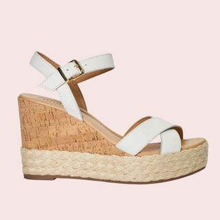 flat lay image of white heeled sandals 