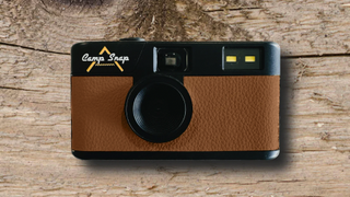 Camp Snap camera, brown version, on a wooden table