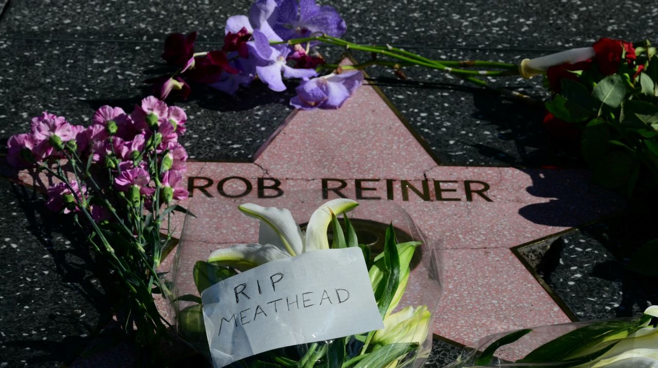 Flowers are left at US actor and director Rob Reiner's Star on the Hollywood Walk of Fame in Los Angeles, California, on December 15, 2025. Reiner's son was charged with murder, police said on December 15, after his father and mother were found dead the previous day in their Los Angeles home. (Photo by Frederic J. Brown / AFP via Getty Images)