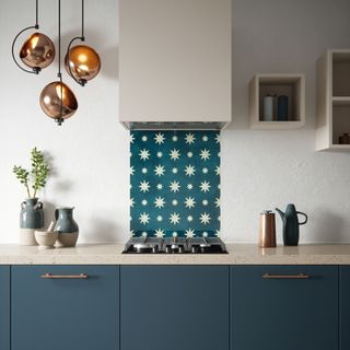 blue kitchen with blue starburst patterned splashback