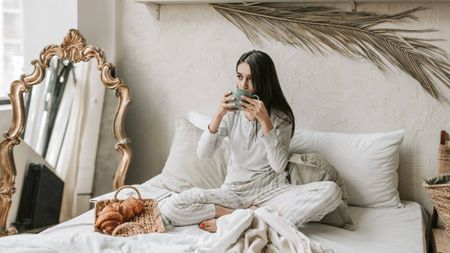 Sleep and Wellness tips, woman eating and drinking in bed