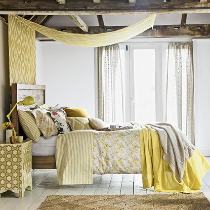 bedroom with wooden flooring and double bed