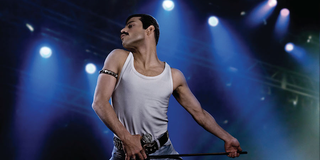 Rami Malek on stage as Freddie Mercury in Bohemian Rhapsody