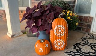 stenciled pumpkins on porch