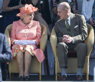 Queen Elizabeth II and Prince Philip, Duke of Edinburgh attend The OUT-SOURCING Inc Royal Windsor Cup 2018 polo match at Guards Polo Club on June 24, 2018 in Egham, England