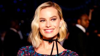 margot robbie on the red carpet with a bob hairstyle