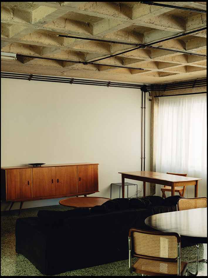 1OAM lofts interiors, midcentury furniture and raw brutalist concrete surfaces