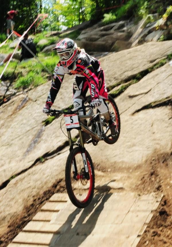 Floriane Pugin in the air over the slick rock.